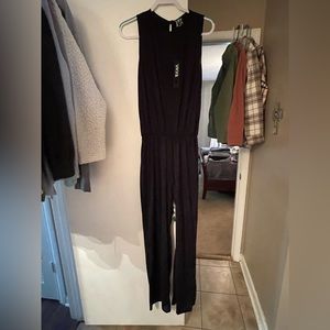 NWT, black pant romper. Super cute and fits TTS.